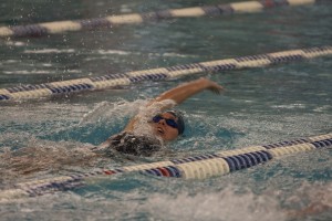 Senior swimmer Hailey Campbell competes in a backstroke event at the Deseret First Dual in Jan. Photo by Natalie Stoker