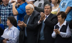 President Samuelson and Elder L. Tom Perry sing the fight song during a basketball game in the Marriott Center. Photo by Sarah Hill