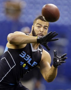 BYU linebacker Kyle Van Noy makes a catch as he runs a drill at the NFL football scouting combine in Indianapolis. (AP Photo/Michael Conroy)