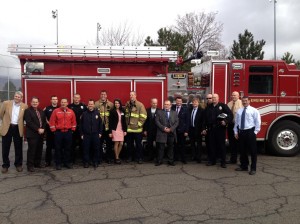 The Russian delegates pose for a photo in front of a firetruck with Orem firefighters, police, and Orem City executives. The delgates toured Orem  public safety facilities and learned about local government. Photo by Taylor Winget.
