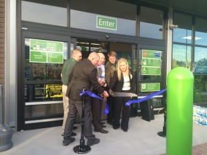 The management team cuts the ribbon to officially open the new Provo Neighborhood Market Walmart.  (Photo by Haylin Martin)