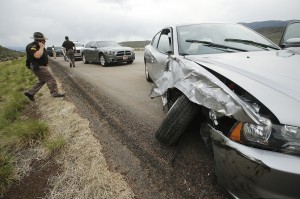 Utah Highway Patrol officers respond after a suspect barricaded himself in his car with an infant hostage on I-15  after the Utah Highway Patrol stopped him in Iron County, Utah, Sunday, April 27 (Photo courtesy Associated Press). 
