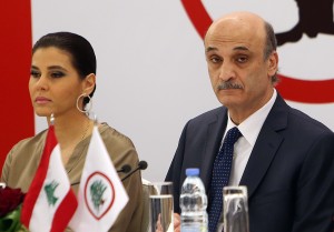 Samir Geagea, the leader of the Christian Lebanese Forces party, right, and his wife Strida Geagea, left, attend a meeting with senior party officials to announce his candidacy for the Lebanese presidency (Photo Courtesy Associated Press). 