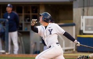 Brock Whitney follows through on a swing in a game against San Diego. Photo by Sarah Hill