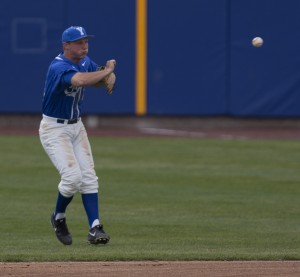 BYU shortstop Hayden Nielsen jumps and throws to first base for an out. Photo by Natalie Stoker
