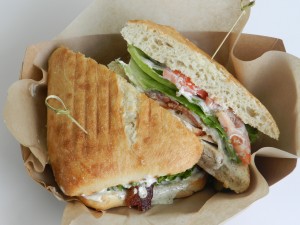 The mediterranean chicken sandwich from Center Street Cafe is favorite filled with juicy chicken, crispy bacon, provolone cheese, fresh tomatoes, lettuce and a basil aioli sauce, all served on ciabatta bread. (Elliot Miller)