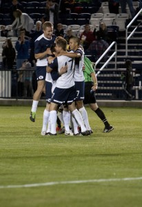 The Cougars celebrate after breaking the tie, to bring the game to 3-2 against FC Tucson. Photo by Natalie Stoker