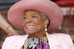 Author Maya Angelou socializes during a garden party at her home in Winston-Salem, N.C. Angelou, author of "I Know Why the Caged Bird Sings," has died, Wake Forest University said Wednesday, May 28, 2014.  She was 86. Photo by Associated Press.
