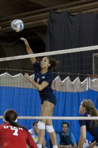 Alexa Gray spikes the ball over the net during the University of Utah game last season. (Natalie Stoker)