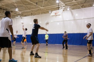 Students practice volleyball together in the Richards Building. Photo by Elliott Miller