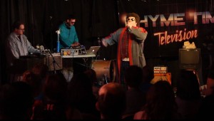 Rhyme Time Television performing for their live audience at Muse Music in Provo in May. Donnie Bonelli, floor manager of RTT said their vision for the show was to be an "'80s slumber party," with '80s imagery, including electric fonts, posed posters of all the band members, pajamas worn by all band members on stage and, in typical slumber-party fashion, a pillow fight. (Photo courtesy of Rhyme Time Television)