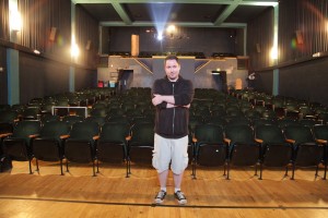 Marcus Salem, manager of the Tower Theater poses in the single 300-seat theater near downtown Salt Lake City. The movie theater that plays indie, classic and foreign films. (Coleman Edwards)