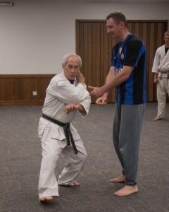 Sucher demonstrates how to effectively block and defend yourself against an opponent to a newer member of the club. 