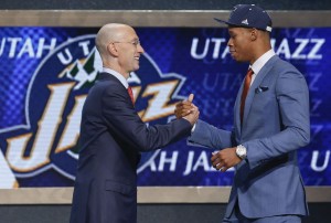 Duke guard Rodney Hood, right, is greeted by NBA Commissioner Adam Silver after being selected 24th overall by the Utah Jazz during the 2014 NBA draft, Thursday, June 26, 2014, in New York. (AP Photo/Kathy Willens)