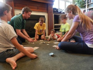 Myles Christensen, mechanical engineering professor, loves spending time with his family, especially playing games such as "Order's Up," pictured above. This is a game he invented where players rush to serve a table of hungry customers. (Jeffrey Allen)