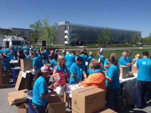 Nuskin employees fill education kits for 30 local title I schools.