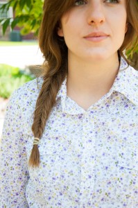Amanda Ballard wears a fishtail braid and small floral print blouse to classes. Pioneer girls would wear their long hair in braids and sport long floral dresses as they trudged across the plains. (Natalie Stoker)