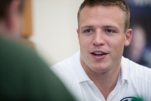 Quarterback Taysom Hill speaks with reporters during Football Media Day.