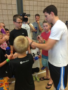 Jimmer Fredette signs for fans at the "Jimmerosity Jam 3ON3 Championships" going on this week on BYU campus. (Jonathan Gunson)