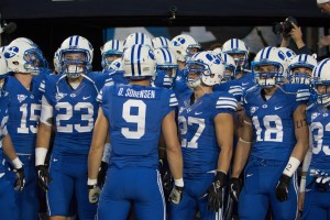BYU defensive back Daniel Sorensen talks to the team before they are to go out on the field. BYU is currently independent, straddling the line between national prominence and mid-major status. (Photo by Ari Davis)