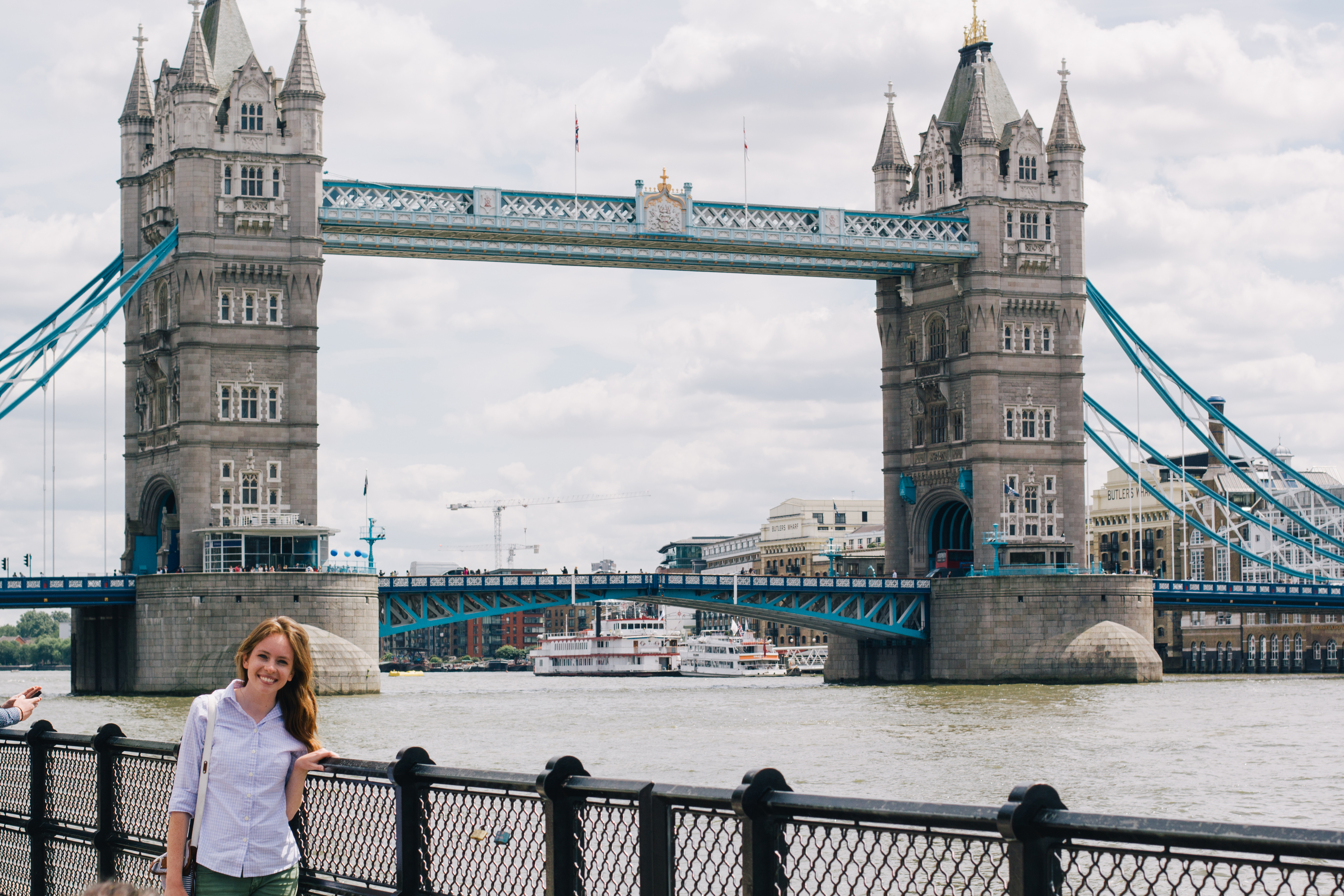 Brooke Alius poses next to Tower Bridge in London, England. Brooke started planning for the trip and bought tickets in February and traveled in June. (Photo courtesy of Brooke Alius)