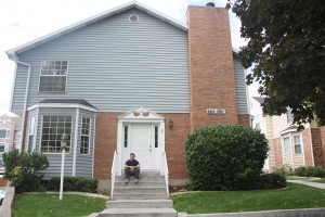 Andrew Lindsey, a public health major from Orem, sees both the pros and cons of living at his parents' home in Provo versus living near campus at Chattham Townhomes.
