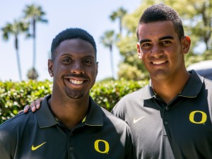 Oregon linebacker Derrick Malone, left, and quarterback Marcus Mariota pose for a photo at the Pac-12 NCAA college football media days at Paramount Studios in Los Angeles, Wednesday, July 23, 2014. (AP Photo)