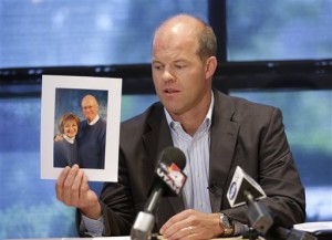 Attorney Paxton Guymon holds a photograph of Jim and Jan Harding during a news conference in Salt Lake City on Thursday, Aug. 14, 2014. Jan Harding, 67, is in critical condition at a Salt Lake City hospital's burn unit, unable to talk and fighting for her life, Guymon said. She drank sweet tea containing a toxic cleaning chemical, severely burning her mouth and throat at a Utah restaurant after an employee mistook the substance for sugar and mixed it into a dispenser, Guymon said. (AP Photo/Rick Bowmer)