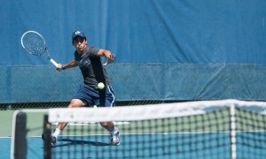 Sophomore Juan Canales prepares to hit a forehand during this weekend's play.