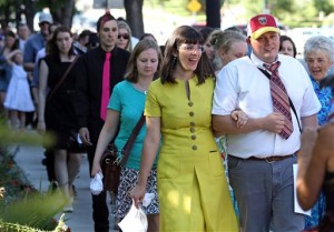 Kate Kelly, center, founder of Ordain Women, walks with supporters to the Church Office Building  during a vigil in Salt Lake City on June 22, 2014. (AP Photo/Rick Bowmer, File)
