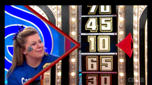 Shaylie Fawcett looks at her second spin result, 10, making her spin total 55. (Photo courtesy CBS)