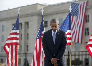 President Barack Obama pauses at the Pentagon, Thursday, Sept. 11, 2014, during a ceremony to mark the 13th anniversary of the 9/11 attacks. (AP Photo/Charles Dharapak)