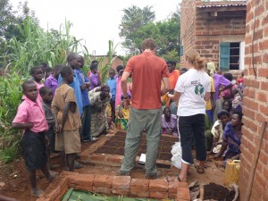 Volunteers with HELP International work with locals in Uganda to create square foot gardens. HELP International tries to focus more on effective international development and less on the adventure part of their trips. 