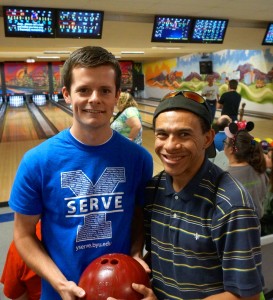 BYU senior Braden Nelson (left) with RAH participant Quincy Brown at Tuesday's bowling activity at Miracle Bowl in Orem. Nelson has volunteered at RAH activities for the past year.