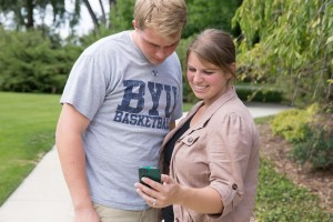 Katie and Matthew Hark check out the Stray Boots BYU Scavenger Hunt app. 
