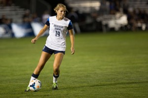 Annie Amos looks for someone to clear the ball to in the game against Colorado College (Universe Photo)