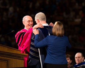 President Henry B. Eyring and Peggy Worthen help place a presidential medallion around President Kevin J. Worthen's neck at Inauguration. 