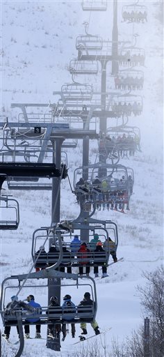 Skiers and snowboarders sit on a lift at Park City Mountain Resort, in Park City, Utah. Vail Resorts Inc. is planning to begin building lifts this summer to connect Canyons Resort and its newest acquisition, Park City Mountain Resort. The Salt Lake Tribune reports that Vail Chief Executive Rob Katz said in the company's financial report for the fiscal year that they will be looking to upgrade or add new lifts, restaurants and snowmakers. (AP Photo/Rick Bowmer, File)