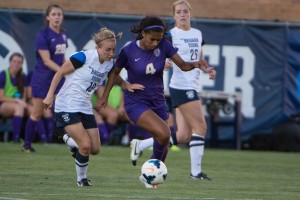 An LSU player dribbles around Sarah Chambers and Madie Lyons of BYU. The Cougars fell 4-3 (Maddie Dayton)