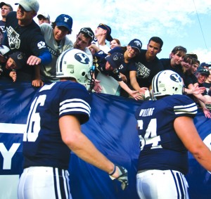 The Cougar team high-five the fans. (Geoffrey McAllister)
