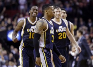 Jazz guard Trey Burke (3) walks to the bench after sinking a three pointer in Utah's pre-season game against Portland on Oct. 9. (AP Photo/Don Ryan)