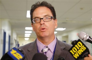 Dr. Richard Labbe speaks to the media about the cancellation of the football season at Sayreville War Memorial High School. (AP Photo/The Star-Ledger, William Perlman) 