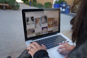 A BYU student and bride-to-be scrolls through her wedding board on Pinterest. More and more brides turn to social media sites and apps like this to plan their big day. (Sierra Baker)