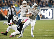 Nevada's Cody Fajardo ran past the Cougars in the Wolfpack's 42-35 win on Saturday. (Photo by Eilliot Miller)