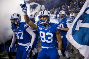 The BYU football team enters the field before the game against Utah State (Universe Photo