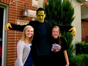 Tom Holmoe dressed as Frankenstein as he posed with his daughter (right) and her friend. (Photo provided by Lori Holmoe)