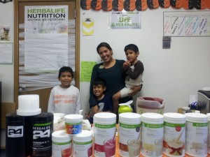Arredondo and her sons at Active Nutrition Zone. Her sons helped her decorate for Halloween. 