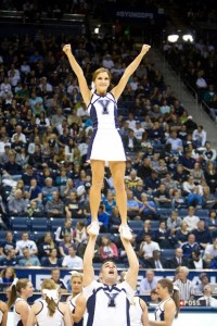 BYU cheerleaders perform stunts at a basketball game. (Universe Photo)