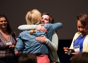 Dawn Armstrong, featured in the Meet the Mormons film, hugs attendees of Education Week. (Elliott Miller)