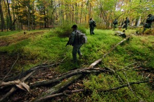 Members of the Scranton, Pa., Police Special Operations Group, search the woods, Thursday, Oct. 2, 2014, in Barrett Township near Canadensis, Pa., for suspected killer Eric Frein. (AP Photo/Scranton Times & Tribune, Butch Comegys)